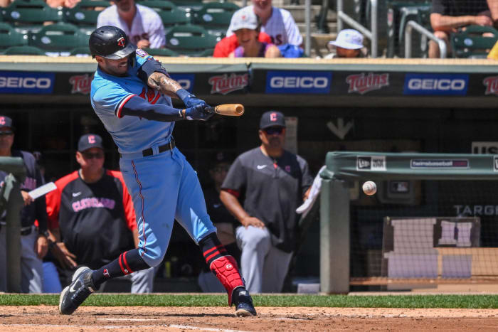 Jun 23, 2022; Minneapolis, Minnesota, USA; Minnesota Twins infielder Carlos Correa (4) hits a single against the Cleveland Guardians during the sixth inning at Target Field. Mandatory Credit: Nick Wosika-USA TODAY Sports